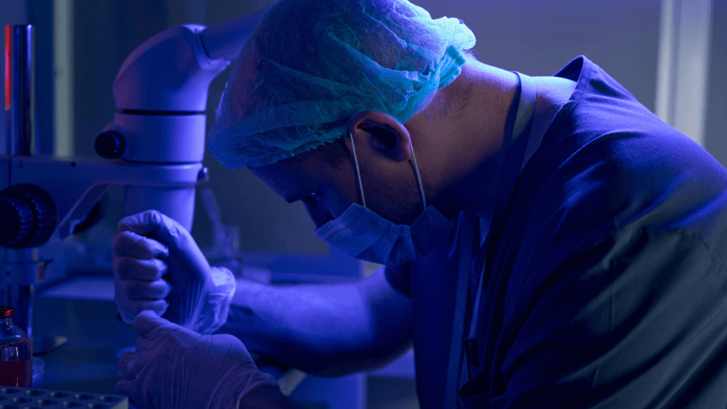 This image depicts a medical professional involved in In Vitro Fertilization (IVF).