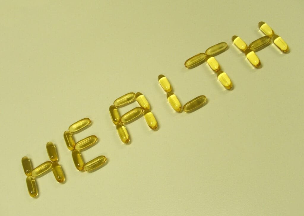 The word "HEALTH" spelled out with fish oil capsules.
