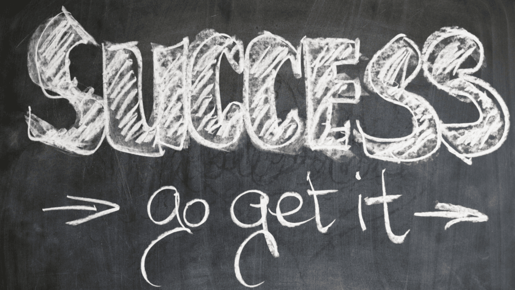 A blackboard with the words "SUCCESS > go get it" written in chalk.